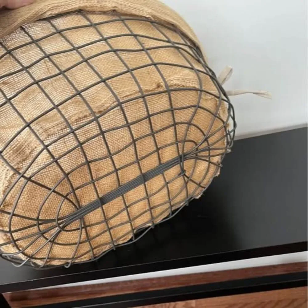 Large wire storage basket with burlap liner